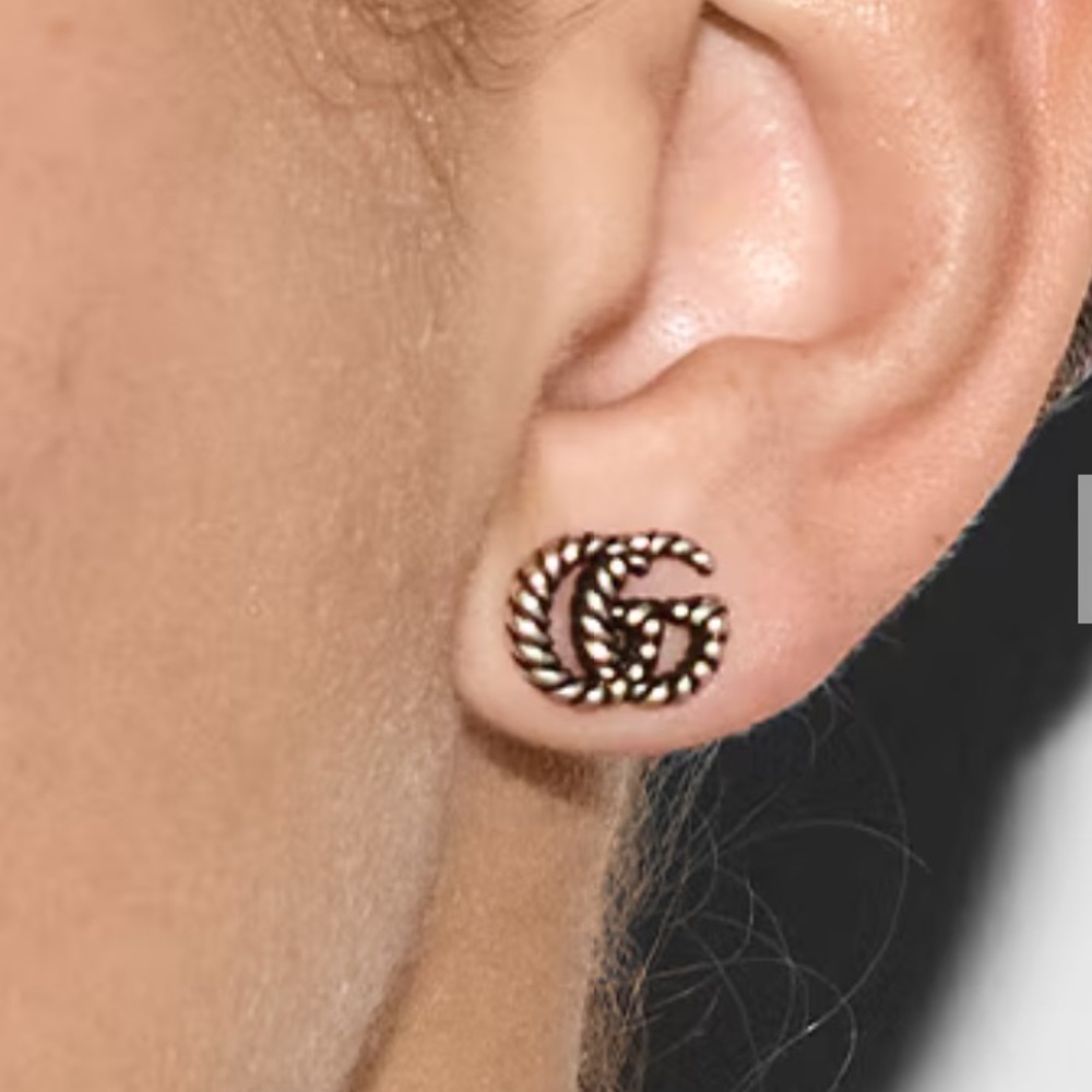 Gucci Earrings 
Emblematic monogram in a twisted,torchon sterling silver design.
